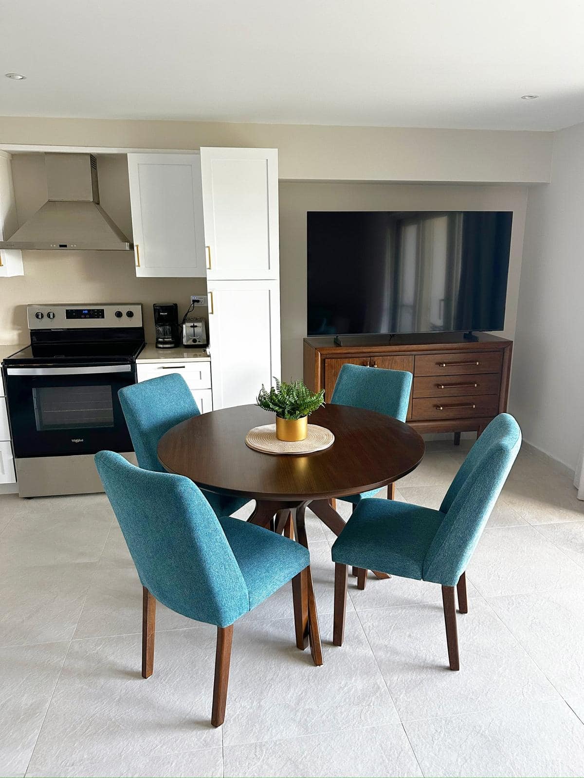 Dining area with teal chairs